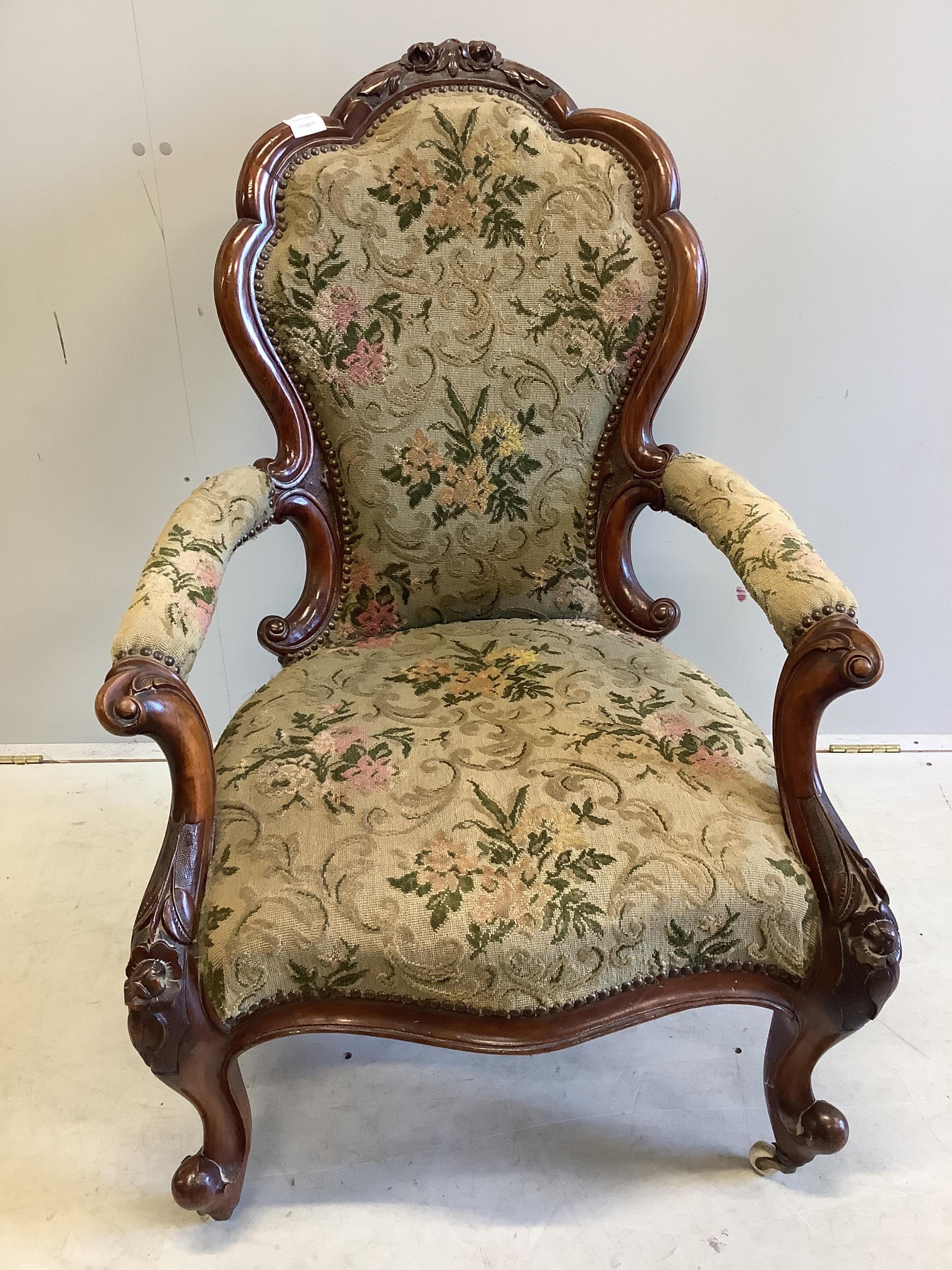 A Victorian walnut upholstered open armchair, width 66cm, depth 60cm, height 100cm. Condition - good